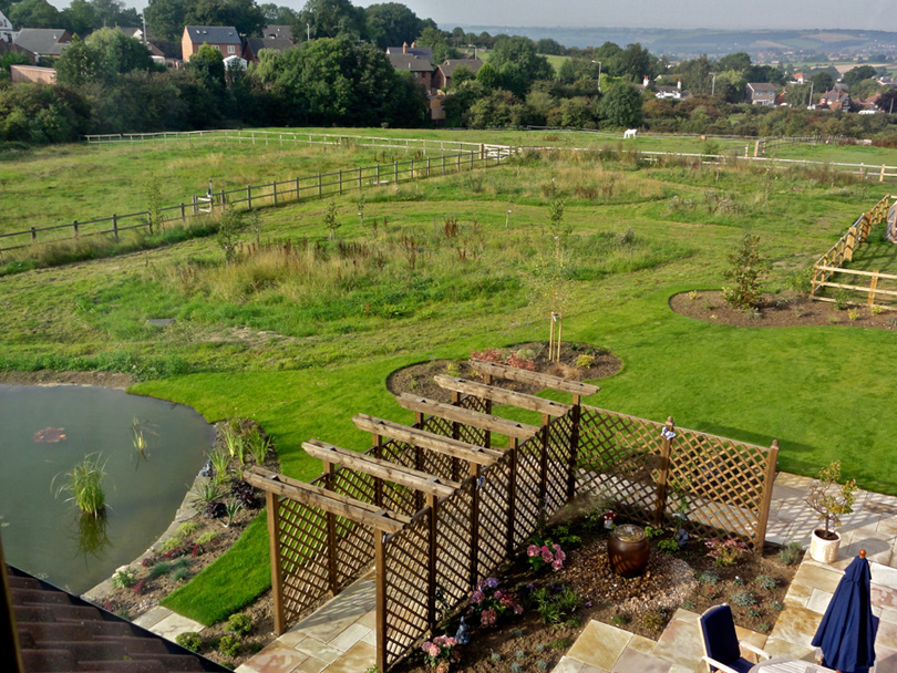 View of the meadows and formal garden from the second floor rooms.