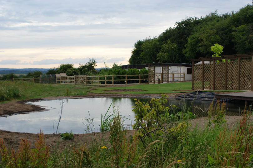 The paddock is complete and plants are ready for planting.